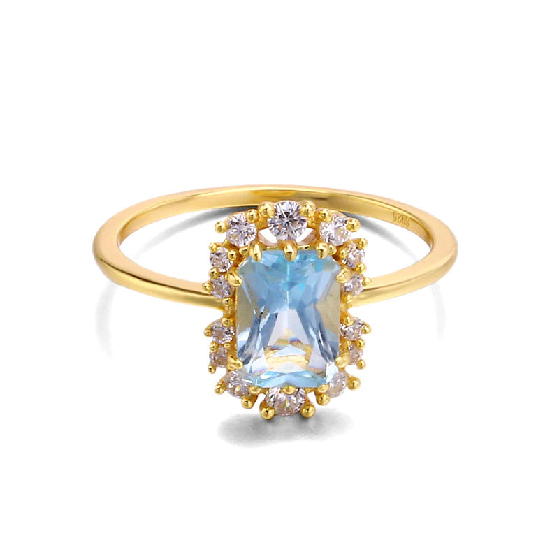 Elena - Eleganter Goldring mit Aquamarin-Edelstein im Halo-Design